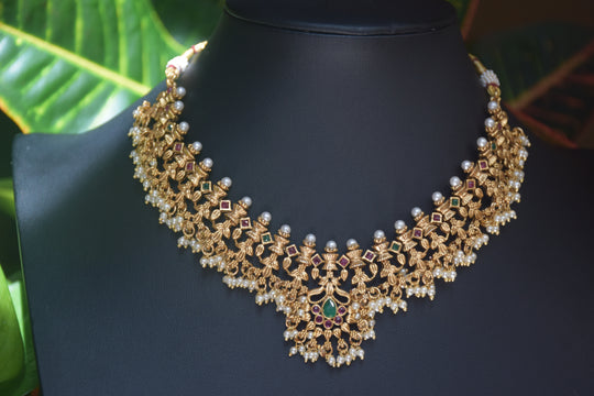 Intricate Gold Polish Pearly Ruby & Green Stone Necklace Set